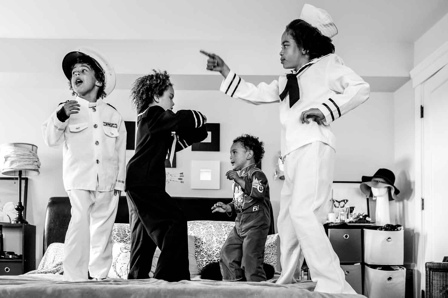 kids dancing on a bed in sailor costumes {San Francisco Family Photographer}