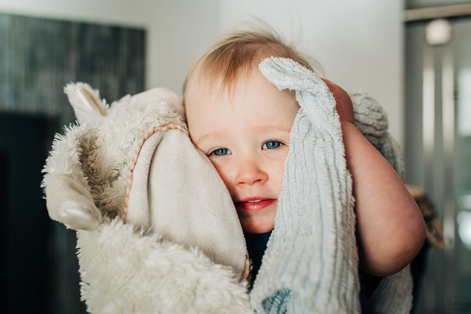 Portrait of a baby girl holding her lovies close to her face | Bay Area Baby Photographer