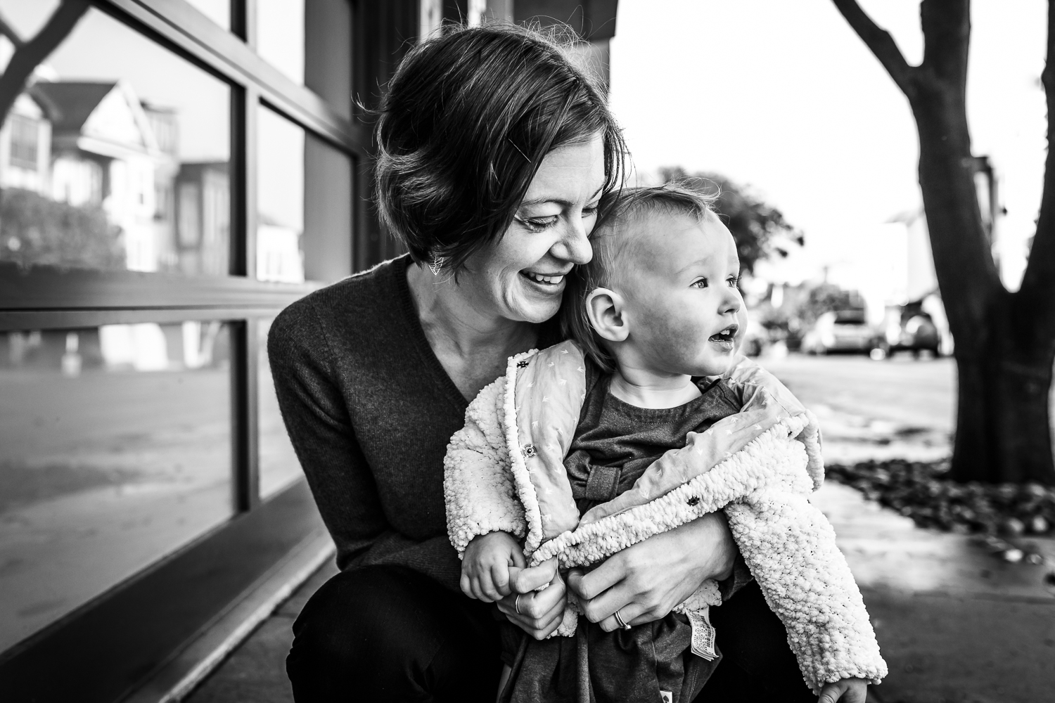 Portrait of a mom and toddler snuggling outside | San Francisco Lifestyle Photographer