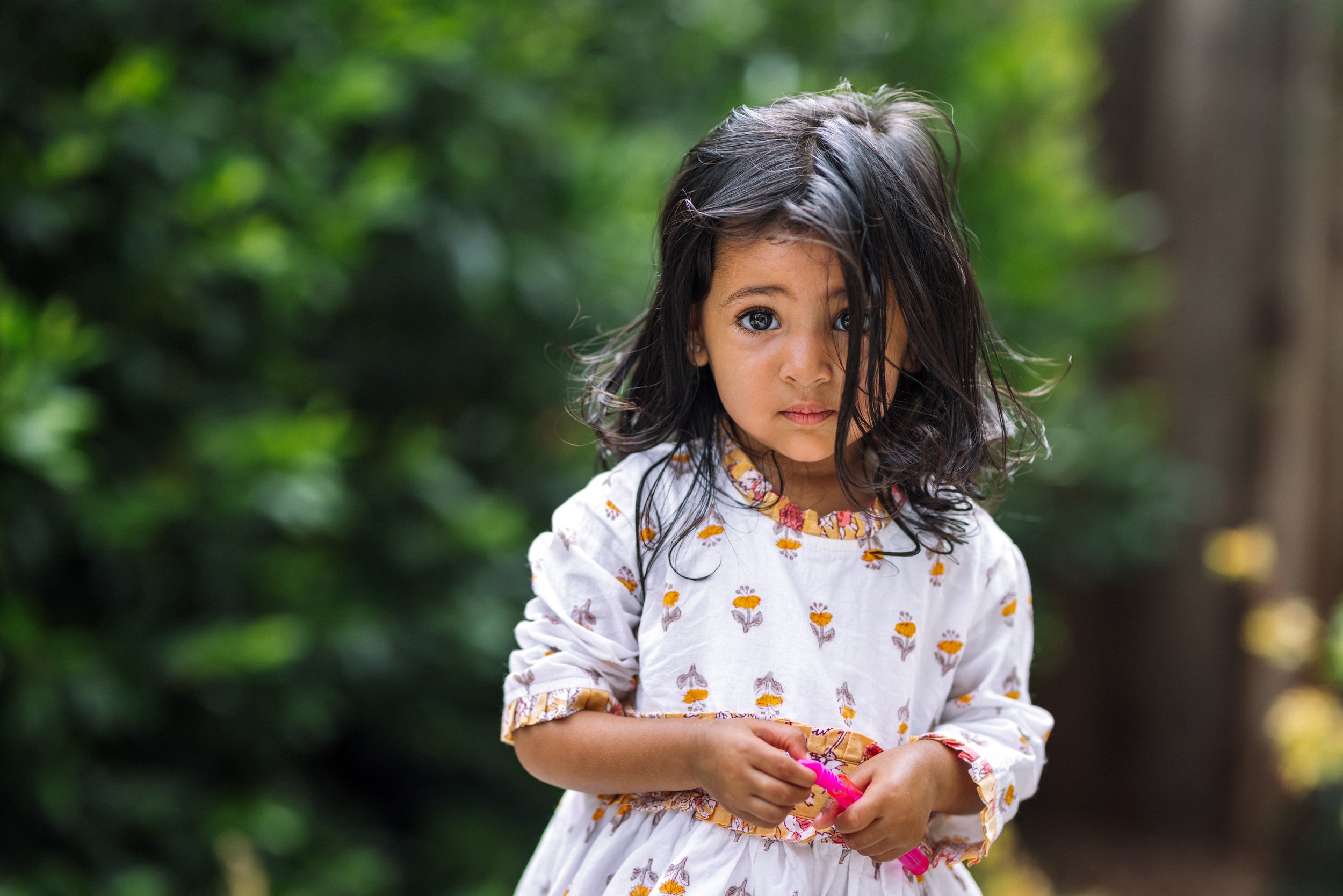 toddler-girl-looking-at-camera-with-serious-expression.jpg