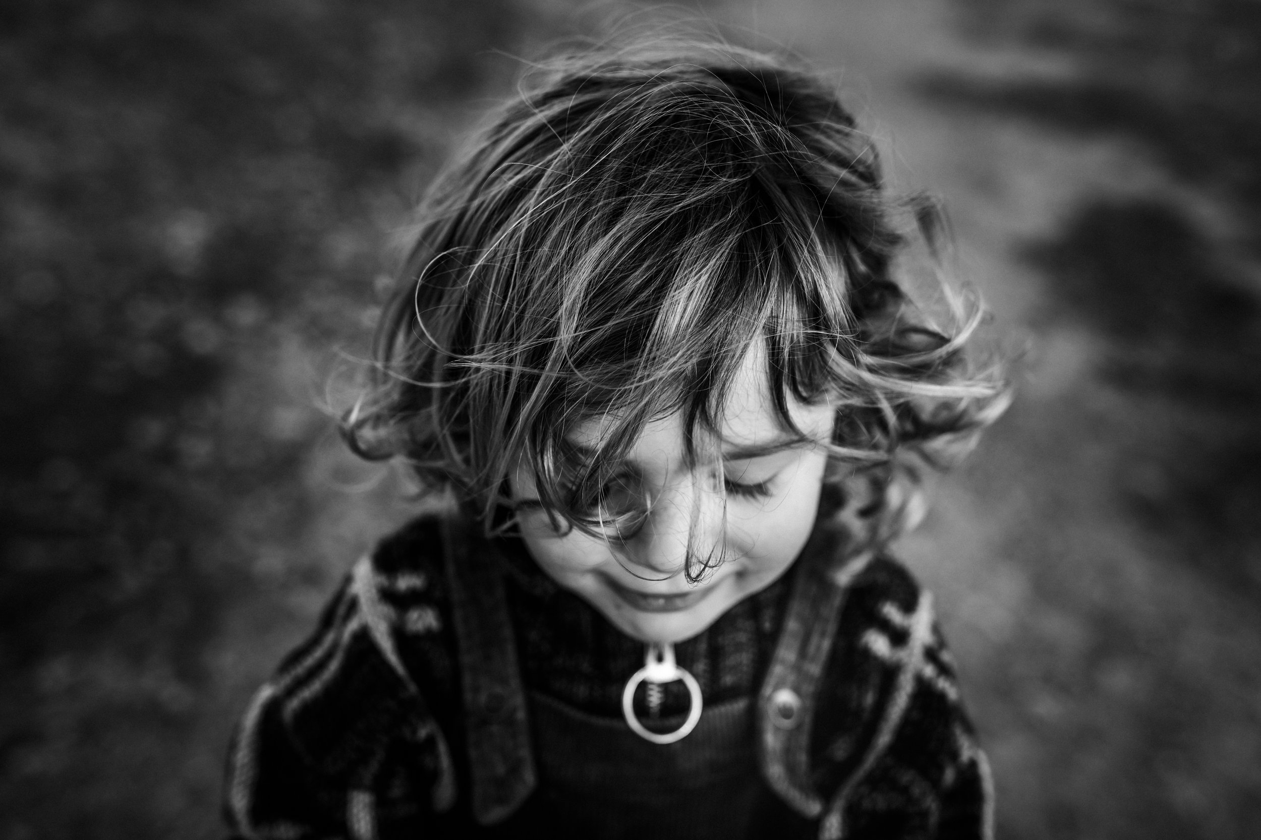 black-and-white-of-boy-looking-down-smiling.jpg