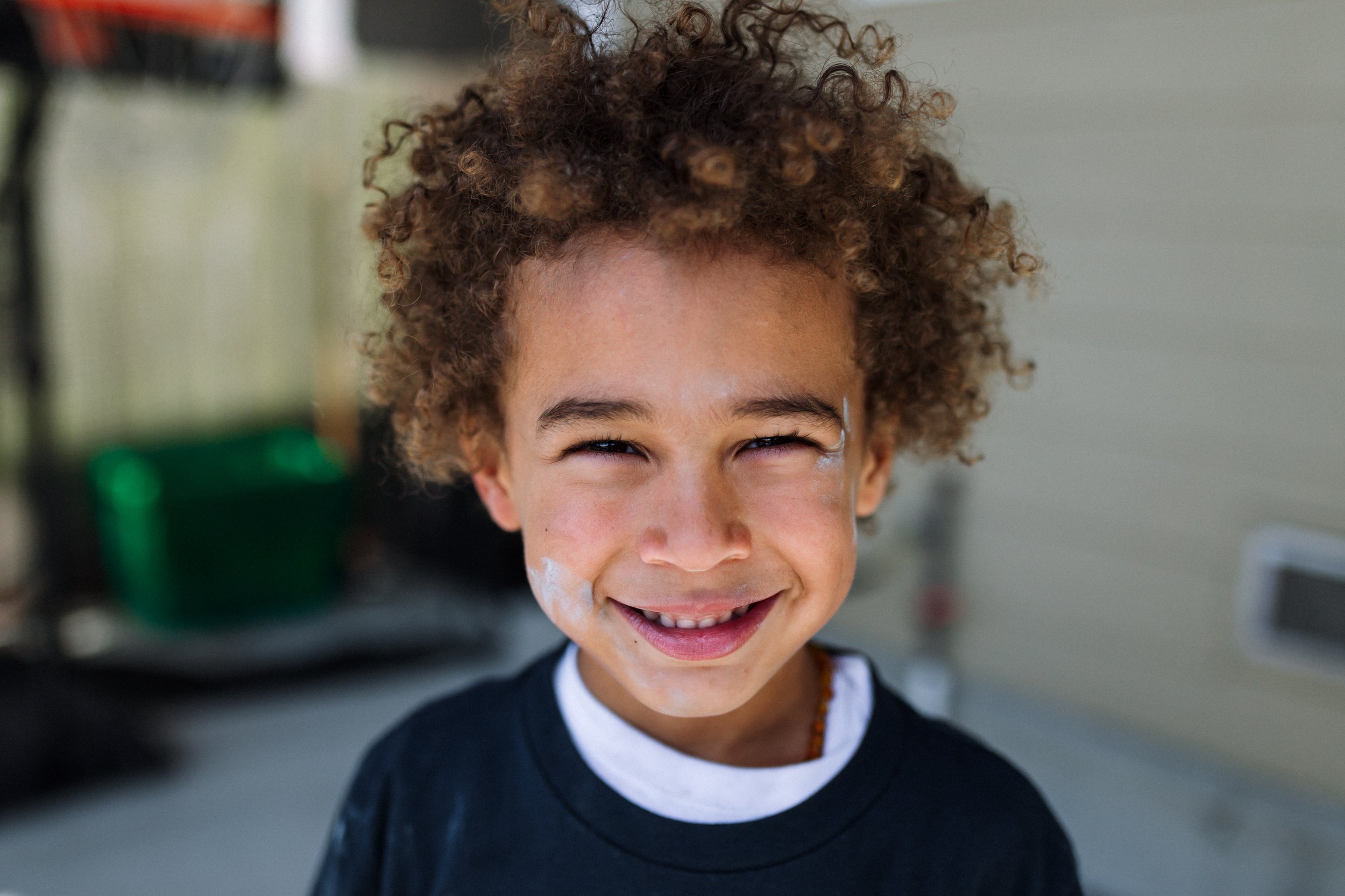 portrait-of preschool-aged boy-with-chalk-on-face.jpg