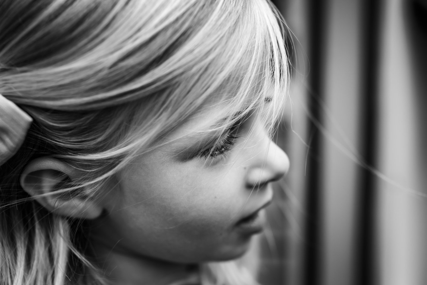 black and white close up profile image of a 4 year old girl