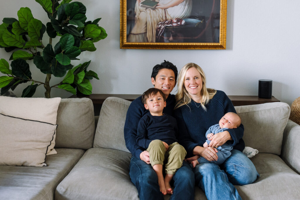 family of four on couch during in-home newborn session Alameda California