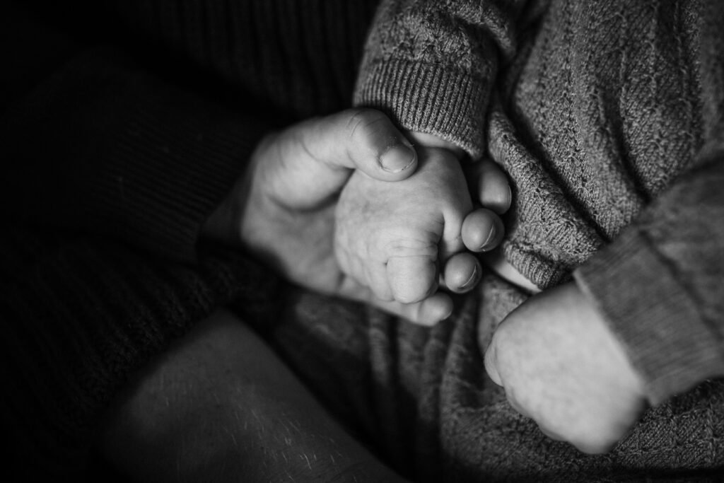 newborn hands held by toddler sibling in-home newborn session East Bay