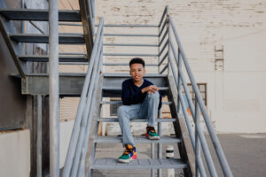 portrait of a boy sitting on metal stairs during East Bay Family Session
