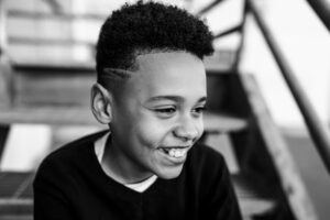 portrait of a smiling boy looking awar during an East Bay family photography session