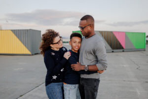Parents and son laughing together during a relaxed East Bay family photography session