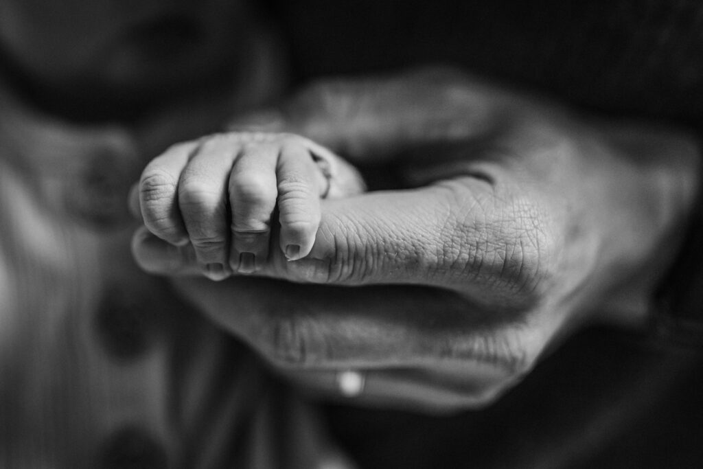 close up of newborn feet in parent's hands Fresh 48 Berkeley